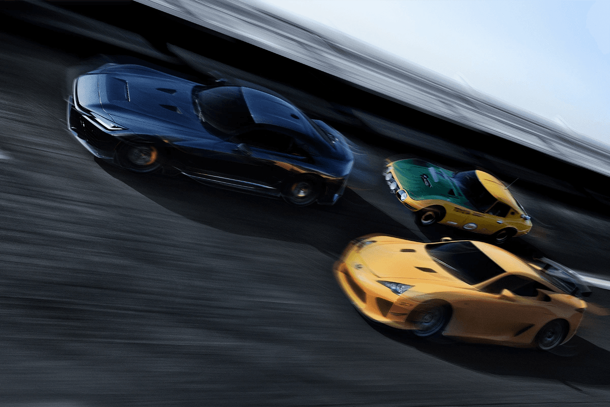 Toyota GR GT driving alongside a Lexus LFA and a Toyota 2000GT in a dynamic motion shot that highlights the brand’s performance heritage.