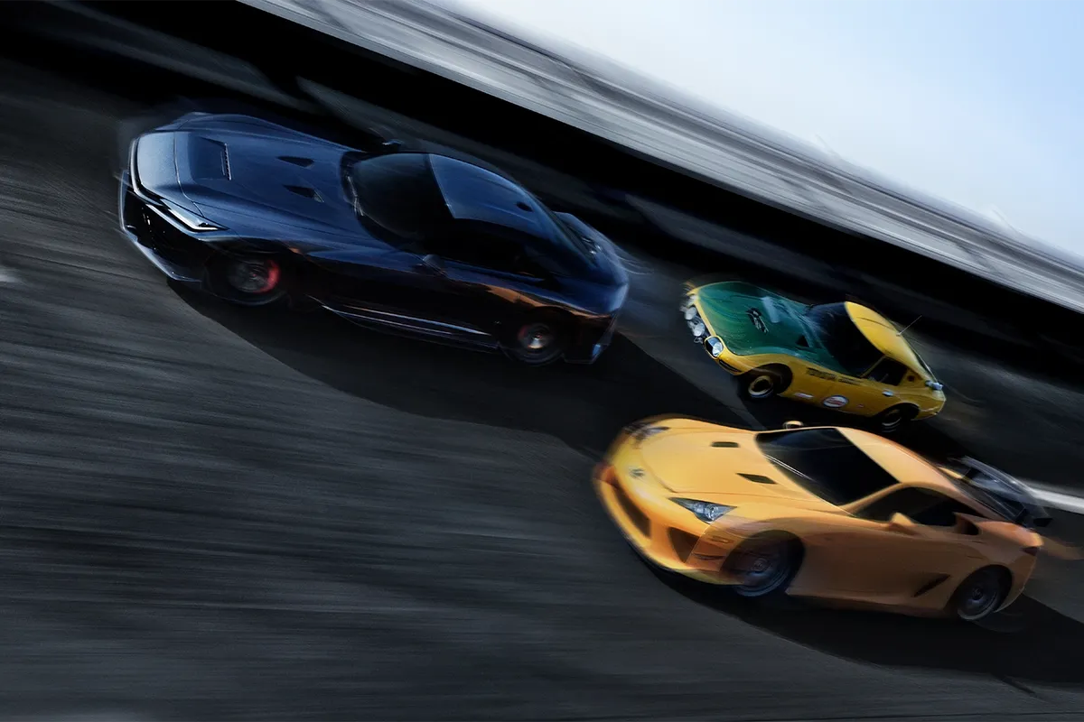 Toyota GR GT driving alongside a Lexus LFA and a Toyota 2000GT in a dynamic motion shot that highlights the brand’s performance heritage.