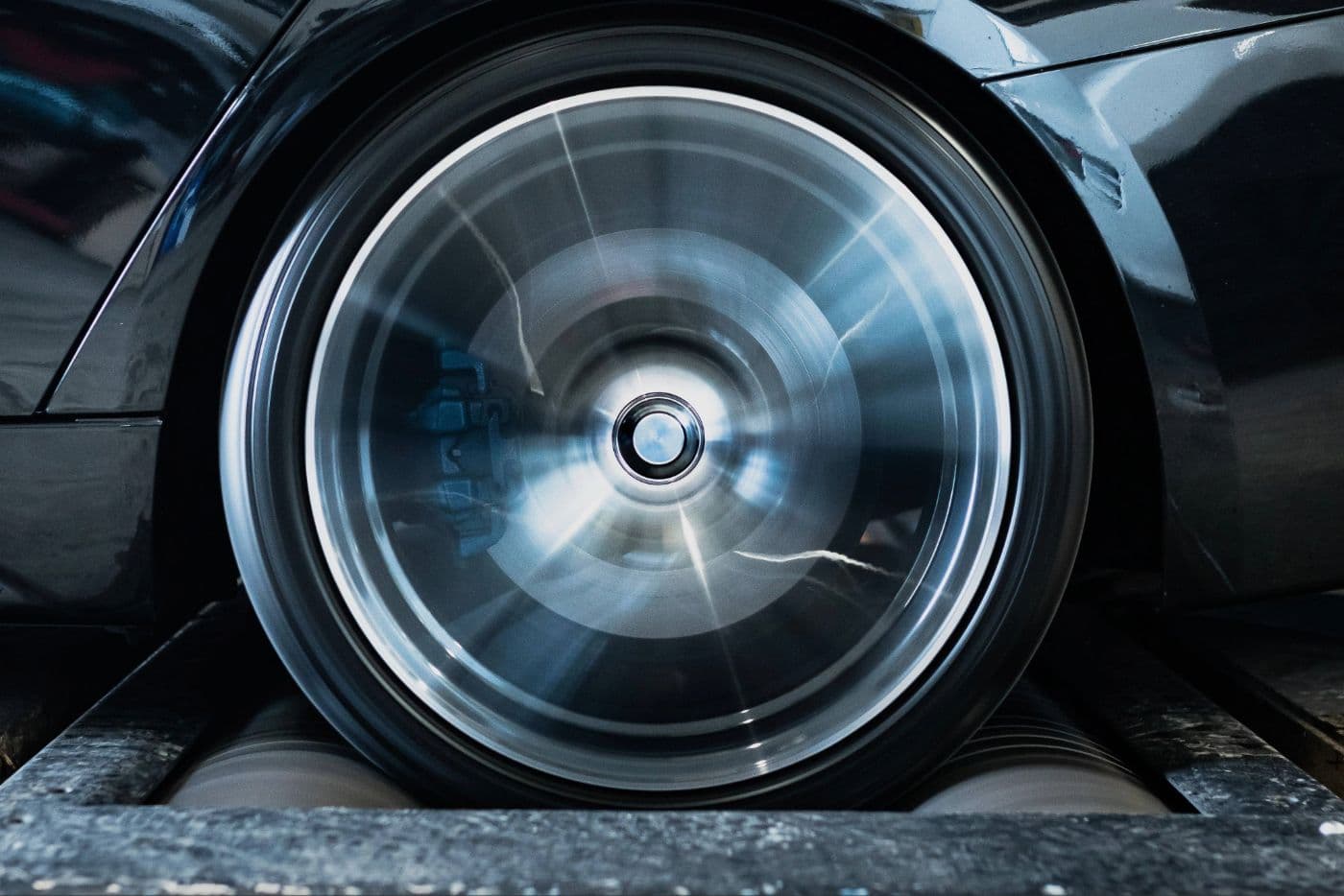 BMW F30 3 Series on a dyno at JBM Performance receiving custom ECU tuning for increased horsepower.