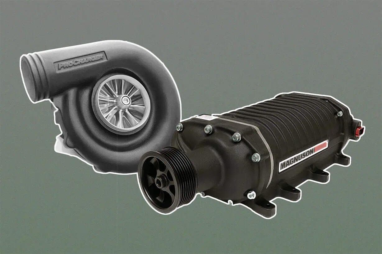 Side-by-side comparison of a ProCharger centrifugal supercharger (left) and a Magnuson Roots-style positive displacement supercharger (right), showcasing their distinct designs and compressor housings.