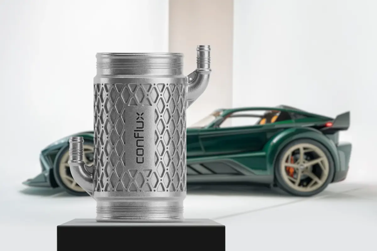 Conflux 3D printed barrel intercooler on display in front of the Donkervoort P24 RS, the 600 hp hypercar that uses twin Conflux water charge air coolers