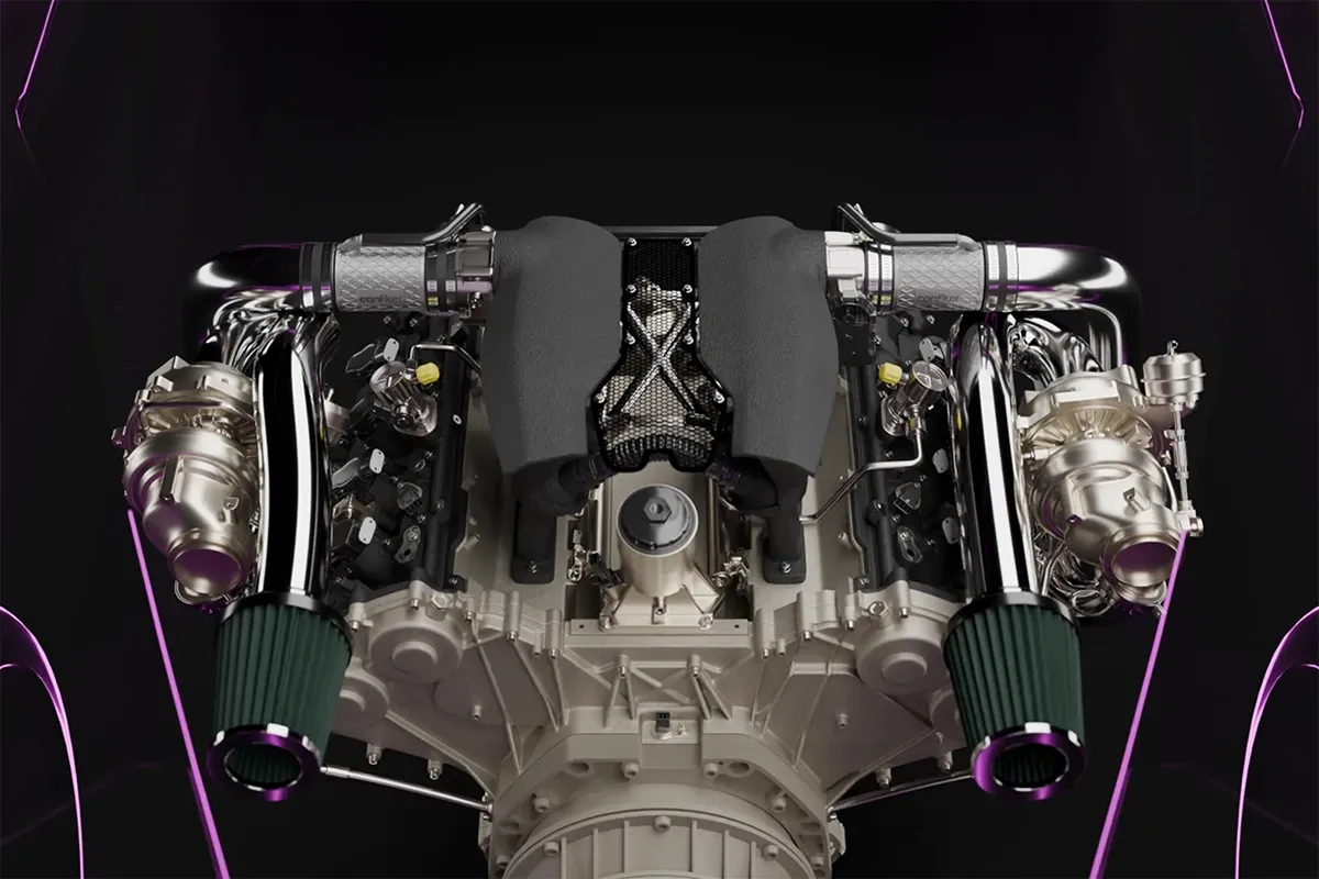 Twin-turbo V engine render with Conflux barrel intercoolers mounted inline between the turbochargers and throttle bodies for a short intake tract