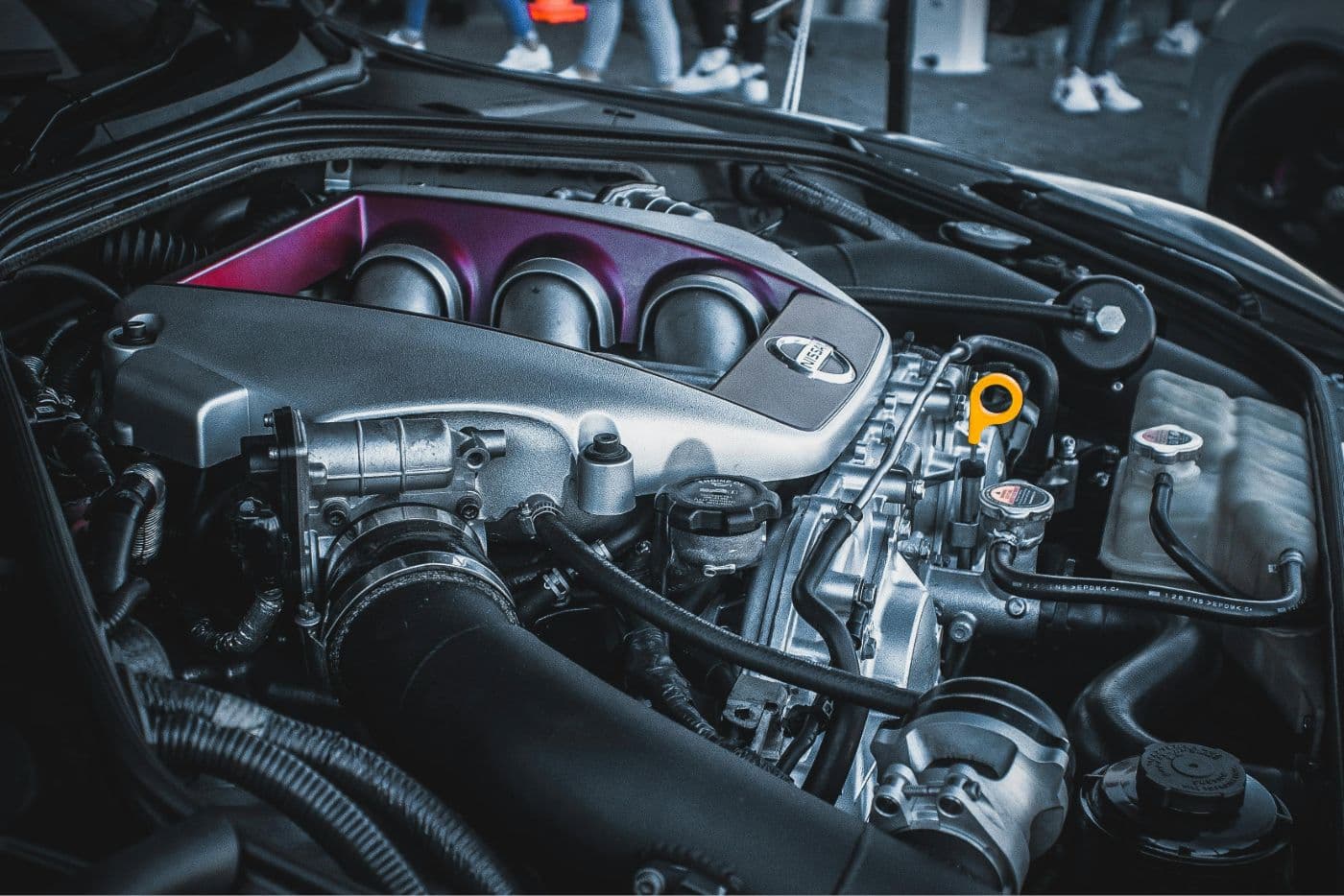 Nissan GT-R R35 VR38DETT engine bay showcasing the tuned intake plenum and twin-turbocharged V6 layout, illustrating high-performance airflow management and volumetric efficiency potential.