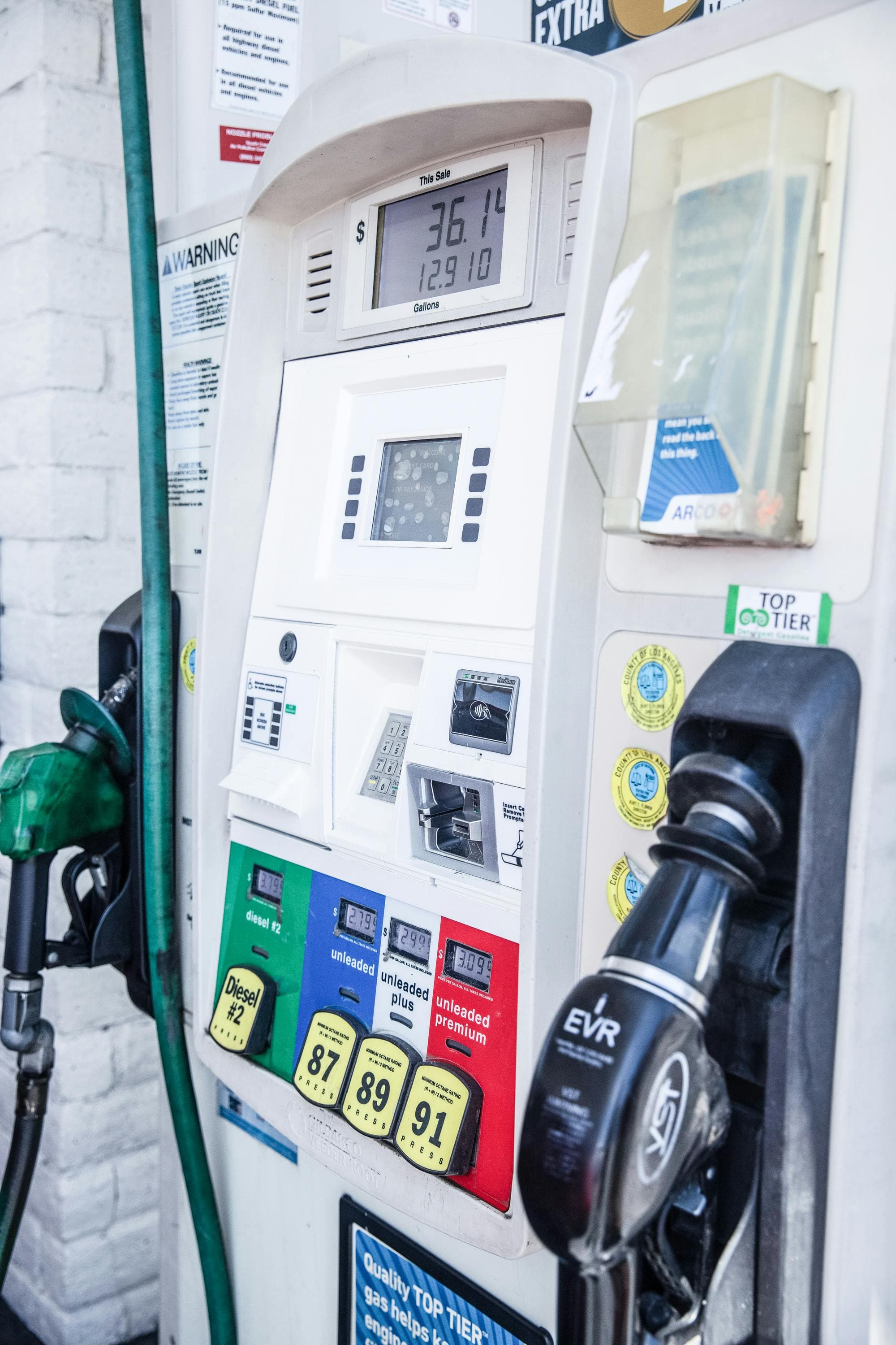 Gasoline pump with diesel, 87, 89, and 91 octane fuel options and visible pricing at an American gas station, representing fuel grade choice.